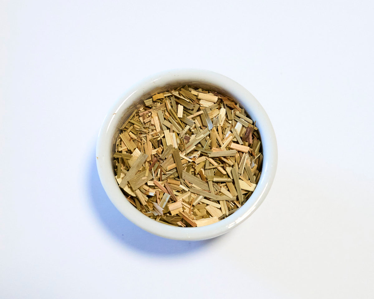 white bowl with lemongrass tea and white background
