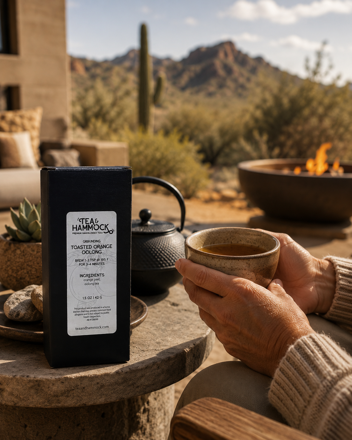 Person holding a cup of tea outdoors with a scenic background