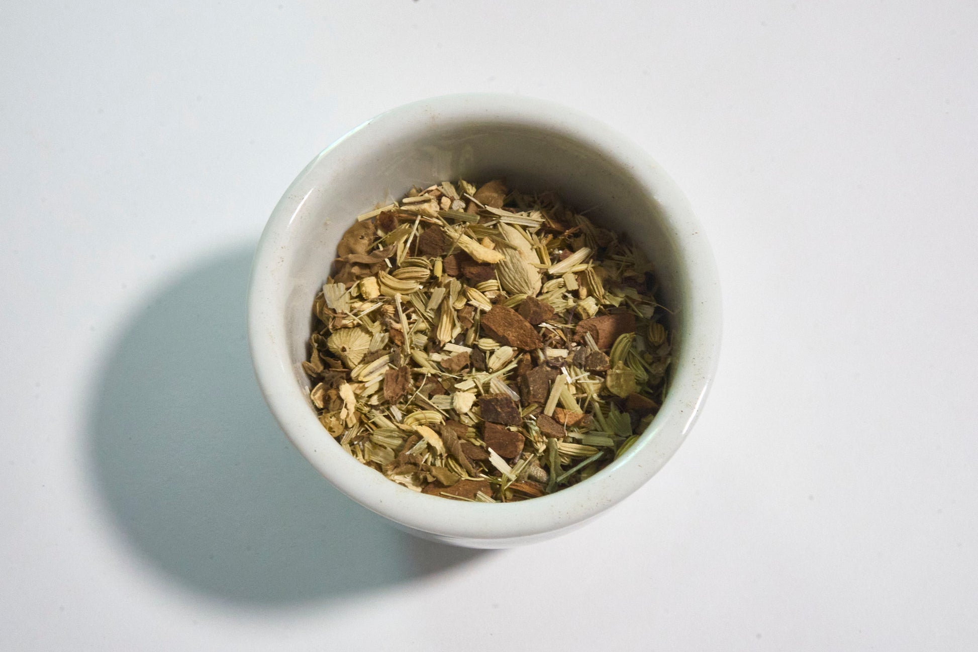 white bowl with Ayuervedic herbal tea blend Pause