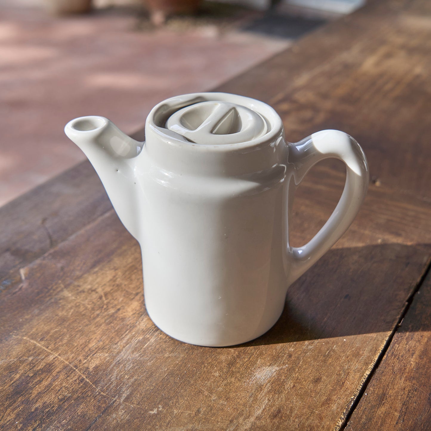 White ceramic teapot